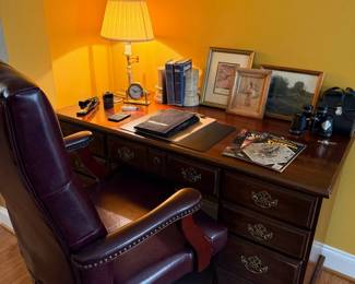 Dark wood executive desk with leather office chair
