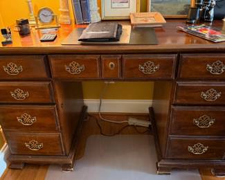 Wood executive desk with drawers, front view