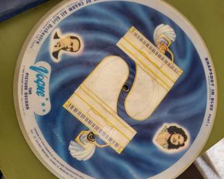 The Hour of Charm All Girl Orchestra was assembled during the great depression in the U.S. in the early 1930s by conductor and band leader Phil Spitalny - They are very collectible mainly for their illustrations printed on both sides of the record.  