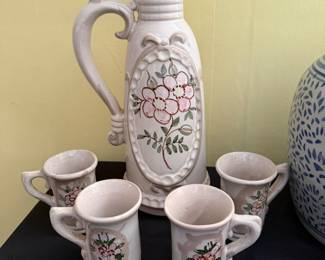 vintage ceramic set consists of a tall pitcher and matching mugs