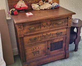 Vintage washstand with three drawers and one cabinet - decorative pulls and carvings