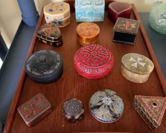 various antique and vintage lidded trinket boxes, pill boxes, and snuff boxes made from different materials. 