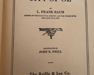 vintage hardcover copy of "The Emerald City of Oz" by L. Frank Baum, illustrated by John R. Neill. 