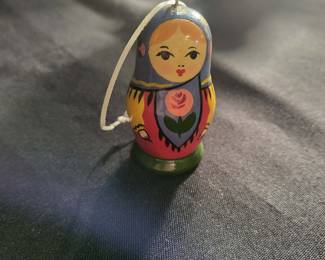 a vintage Russian Matryoshka nesting doll ornament, a handcrafted wooden collectible often produced as a set of nested dolls. 