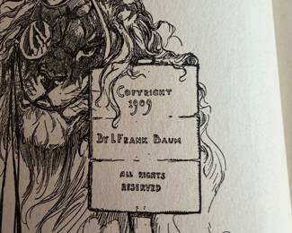 vintage hardcover edition of the children's book The Road to Oz by L. Frank Baum, featuring cover art by John R. Neill. 