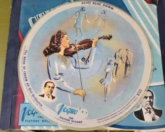 The Hour of Charm All Girl Orchestra was assembled during the great depression in the U.S. in the early 1930s by conductor and band leader Phil Spitalny - They are very collectible mainly for their illustrations printed on both sides of the record.  