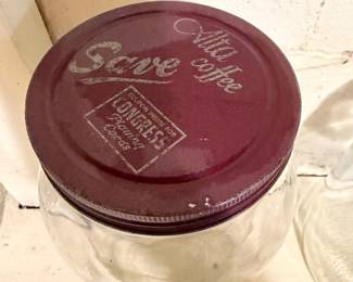 a vintage collectible glass coffee jar, often referred to as a "kitchen canister" or "advertising jar