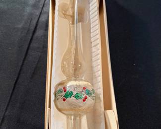 vintage Bradford Christmas tree topper is made of blown glass and features hand-painted holly leaves and berries with gold glitter accents. 