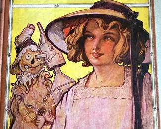 vintage hardcover edition of the children's book The Road to Oz by L. Frank Baum, featuring cover art by John R. Neill. 