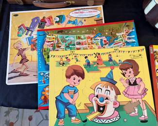 a collection of vintage frame-tray puzzles from the 1960s