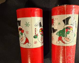 vintage Hallmark cardboard tubes featuring Christmas scenes of Santa Claus, commonly used as decorative match holders. 