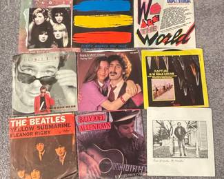Collection of 1980s Music 45 RPM Vinyl Records - Featuring Blondie, The Police, USA for Africa, Huey Lewis & The News, Frank & Moon Zappa, The Beatles, Billy Joel, and Bruce Springsteen