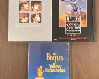 The Beatles A Hard Day's Night DVD, The Rolling Stones Bridges to Babylon Tour '97-'98 Live in Concert DVD, and The Beatles Yellow Submarine DVD