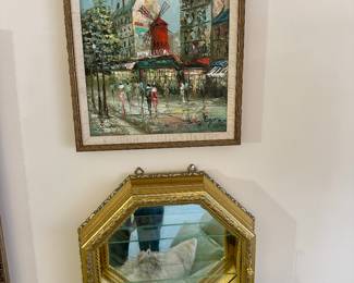 Mid century oil painting and vintage Horchow mirror and gold display cabinet.