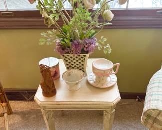 Cute side table with decor.