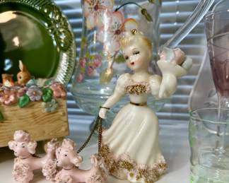 1950's Lefton Shopping girl with pink spaghetti poodles.