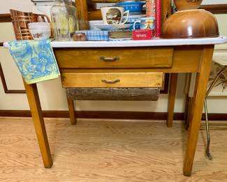 Primative enamel top bakers table with flour and sugar bin.