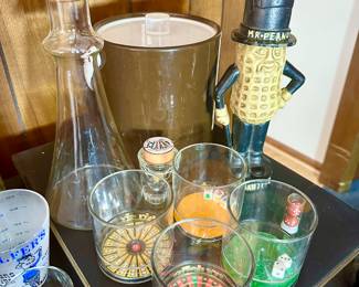 Vintage cast iron MR. peanut bank, Dansk decanter and vintage barware.