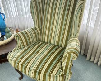 Velvet down filled, carved legged Henredon wing back chair.