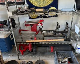 Outers Varminter Rifle Stand; Trius clay pigeon thrower; free weight plates; Toro blower vac; woodworking tool; Coleman cooler