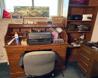 Roll top desk; desk and display cabinet; bookshelf; nautical instruments