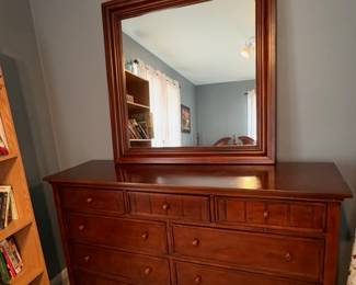 Thomasville dresser with a matching mirror, featuring a 9-drawer