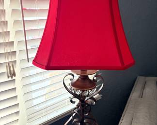 Wrought  iron table lamp with red shade 