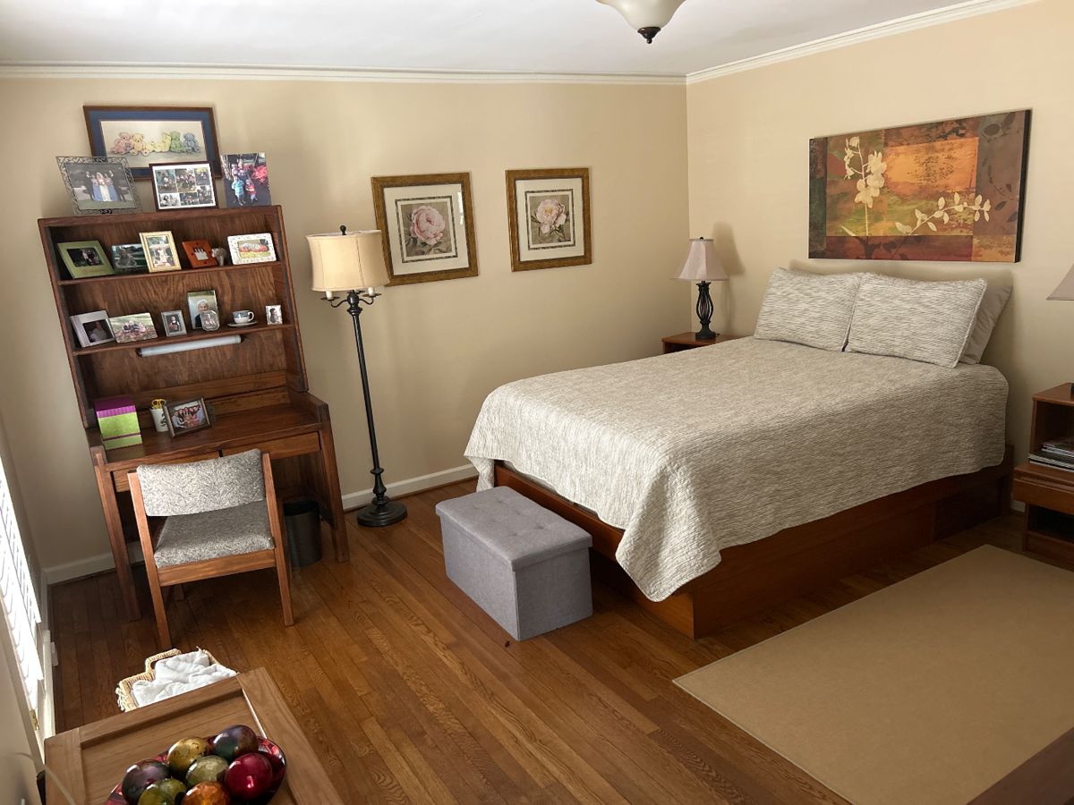 Queen bed, gray canvas storage bin, framed art, rug
Desk - SOLD