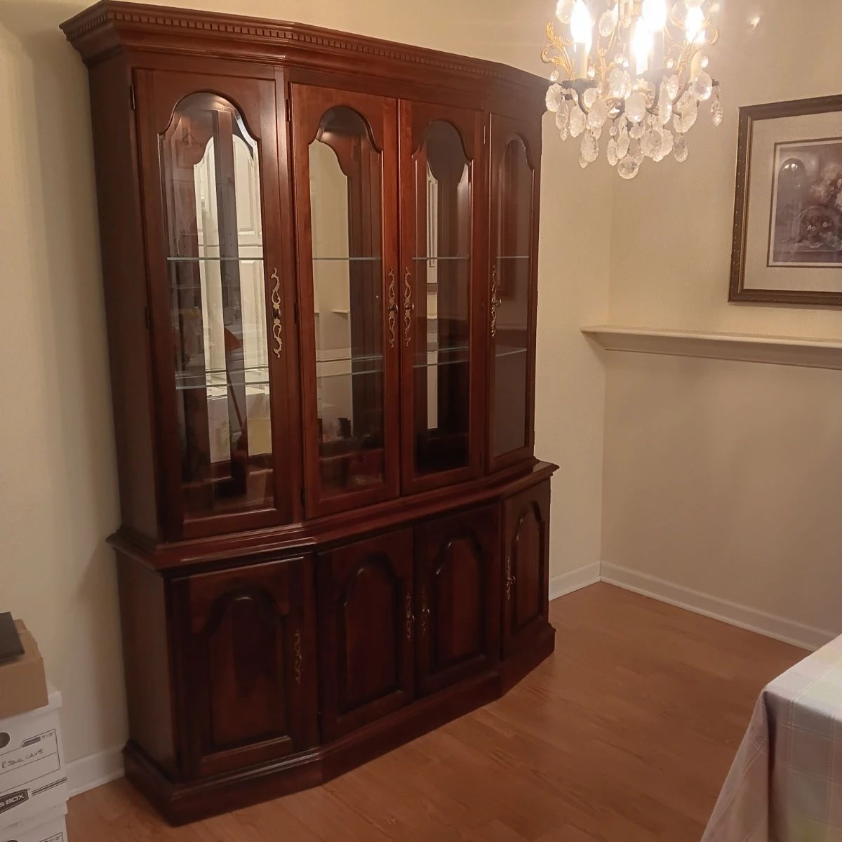 Pennsylvania House Quality Cherry China cabinet. Very good condition, beveled glass door, glass shelves, lighted, bottom drawer has felt silverware rack.  Measures 78.5" tall, 15" deep, 62" across.  It appears to come apart into 2 pieces but not sure.  $100.