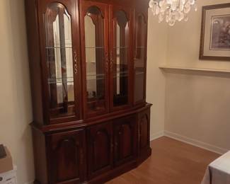 Pennsylvania House Quality Cherry China cabinet. Very good condition, beveled glass door, glass shelves, lighted, bottom drawer has felt silverware rack.  Measures 78.5" tall, 15" deep, 62" across.  It appears to come apart into 2 pieces but not sure.  $100.