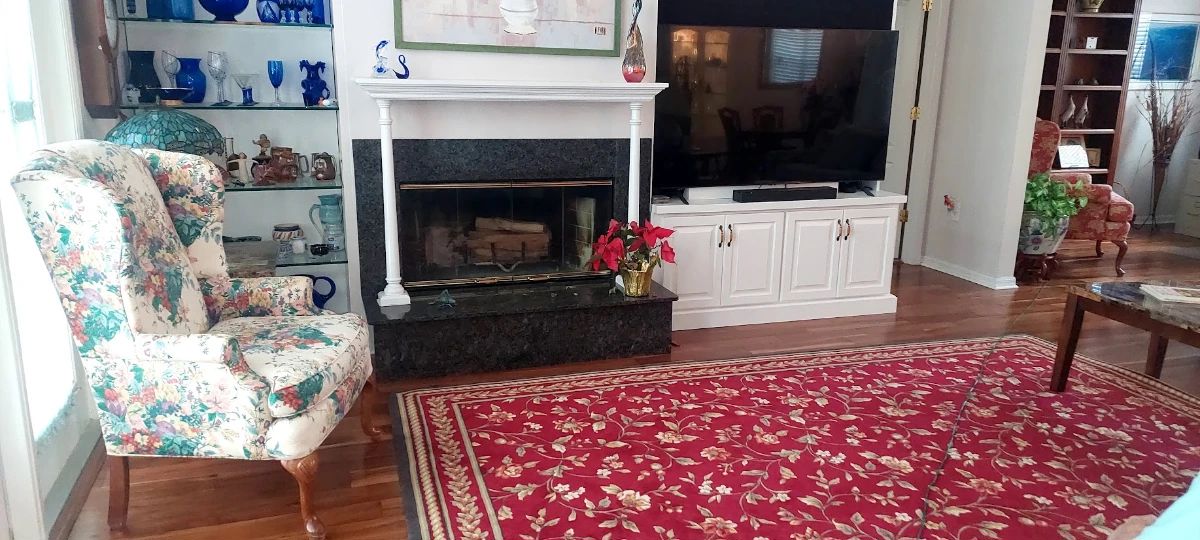 220 red floral rug. Wing back left not for sale
