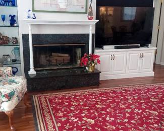 220 red floral rug. Wing back left not for sale