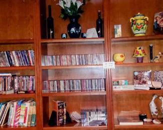 220 shelf unit of CDs, DVDs, etc.