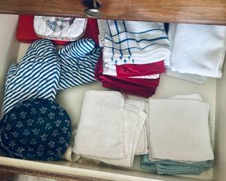 Kitchen drawer of pot holders, dish towels 