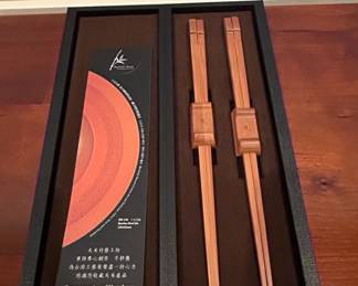 Beaded Handle Serving Set, Decorative Trivet, Pottery Barn Napkins, Wooden Chopsticks, Lacquered Chopsticks, and Fabric Coasters third image