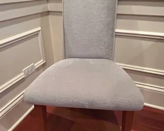 Modern Glass Top Dining Table with Upholstered Chairs fourth image