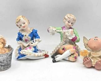 1928  4 Figurines 