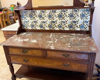Victorian marble top washstand with detailed tiled backsplash