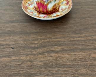 Ornate Antique Demitasse Cup and Saucer Set with Gold Gilding and Floral Motifs