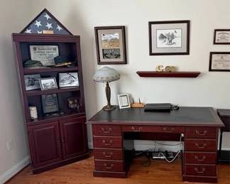 Traditional cherry executive desk and matching bookcase/display cabinet. Desk has leather-top writing surface, double pedestal with multiple drawers and brass hardware. Bookcase has glass display shelves on top and cabinet storage below. Both pieces are solid wood and in great condition. Desk dimensions: approximately 5’ wide Bookcase: approximately 6’ tall (Desk and BookShelf only) Lamp for sale seperatly.