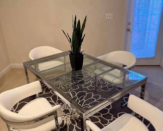 Modern chrome and glass extendable dining table paired with 4 white faux leather barrel by VIG Furniture (chairs purchased 2020). Selling as a set. Table extends to accommodate more guests. Contemporary style, great condition. Perfect for a dining room, game room, or open-concept space