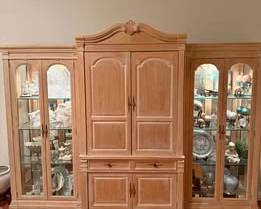 Solid wood construction • 3 separate pieces for easier moving • Lighted glass display shelves (lights work) • Center cabinet with upper storage doors • Two drawers for storage • Lower cabinet storage • Glass doors on both side towers • Adjustable glass shelving Very well cared for and structurally solid. No major scratches or damage. Perfect for: • Dining room china display • Living room statement piece • Home office storage • Large wall entertainment storage (Items in cabinet for sale seperatly)