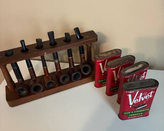 Antique pipes, rack and tins