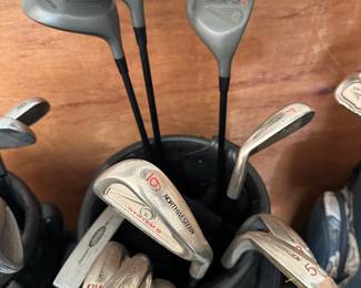 Several golf club sets: Big Bertha, Northwestern, Callaway, Cobra