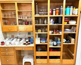 Collection of mugs and food storage containers. 
