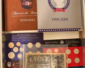 A collection of United States collectible coin sets Smokey Bear Edition.
