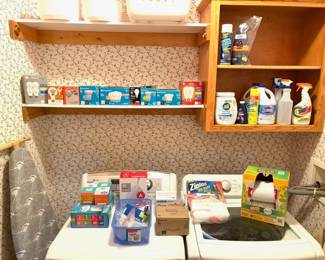 Collection of new and vintage light bulbs and cleaning supplies.