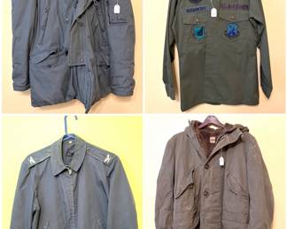 A vintage USAF N-3B extreme cold weather parka, a vintage U.S. Air Force lightweight jacket, a Vintage USAF OG-507 Tactical Air Command & AWACS Fatigue Shirt, and a vintage U.S. Army M-1947 cold weather parka. 