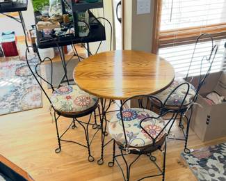A set of vintage ice cream parlor table and chairs. 