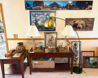 A pair of Chapman Hollywood Regency brass palm frond table lamps and a MCM Teamson Home Arquer Arc Floor Lamp, vintage crewel and framed art. 